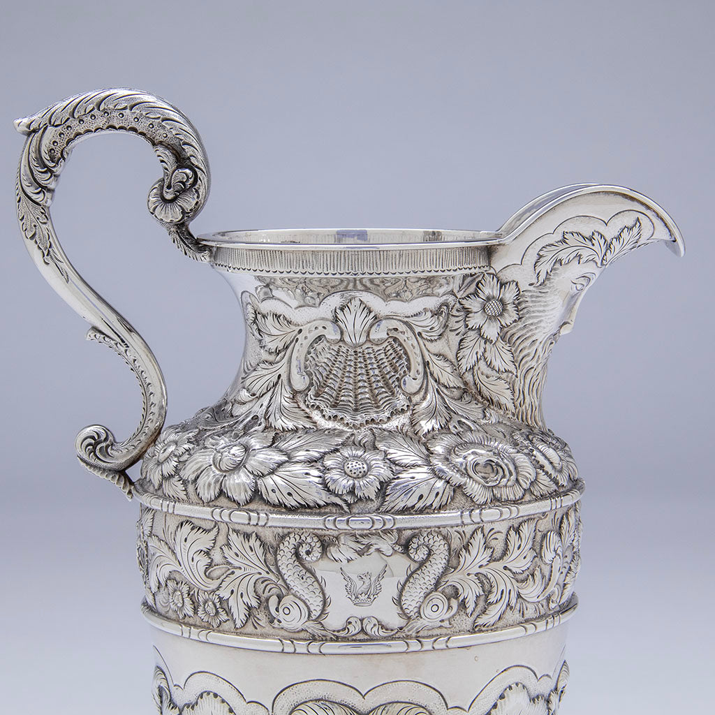 top detail of Samuel Kirk 11oz Silver Armorial &#39;Gilmor&#39; Ewer, Baltimore, c. 1840, bearing the crest of Stone