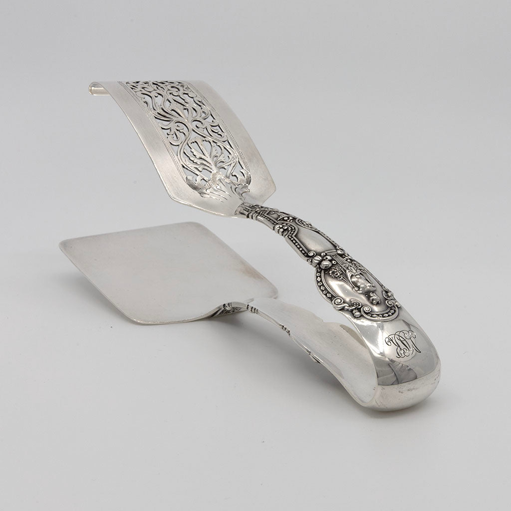 Resting Tiffany &amp; Co 'Renaissance' Pattern Antique Sterling Silver Asparagus Tongs, New York, c. 1910