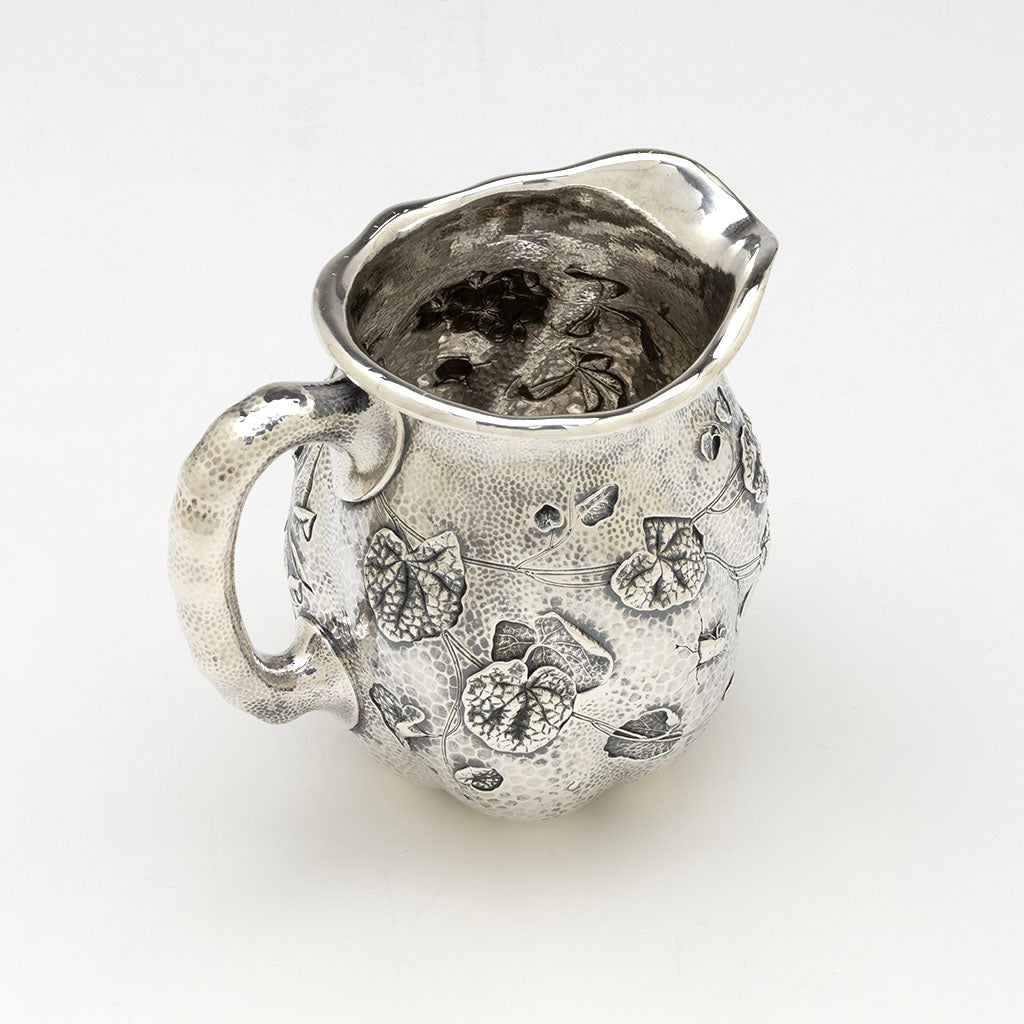 Angle view of Dominick &amp; Haff Sterling Intaglio Chased Aesthetic Movement Pitcher, 1883