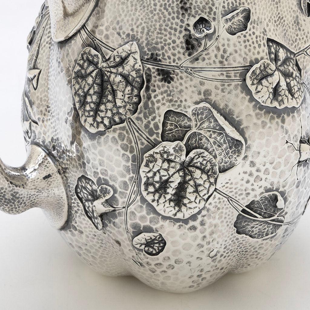 Lily pad detail on Dominick &amp; Haff Sterling Intaglio Chased Aesthetic Movement Pitcher, 1883