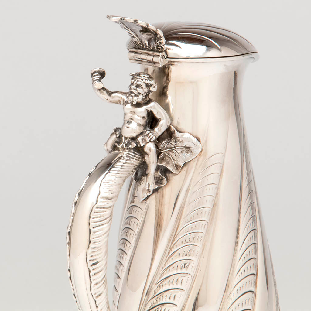 Bacchanal on handle of the Gorham Antique Sterling Silver Champagne Pitcher, Providence, RI, 1887