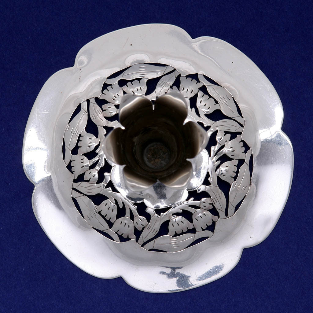 Top view of  A beautiful and rare form, these arts &amp; crafts candlesticks are wonderfully hammered, pierced and chased with floral decoration. The petal-shaped bases are slightly domed with rising candleholders also in the forms of blossoming flowers. Panis is known for his floral pierced silver jewelry and these are wonderful examples of his famous style and technique in holloware.  Stavre Gregor Panis is listed in The Society of Arts &amp; Crafts, Boston Exhibition Record 1897-1927 by Karen Evans Ulehla. He is