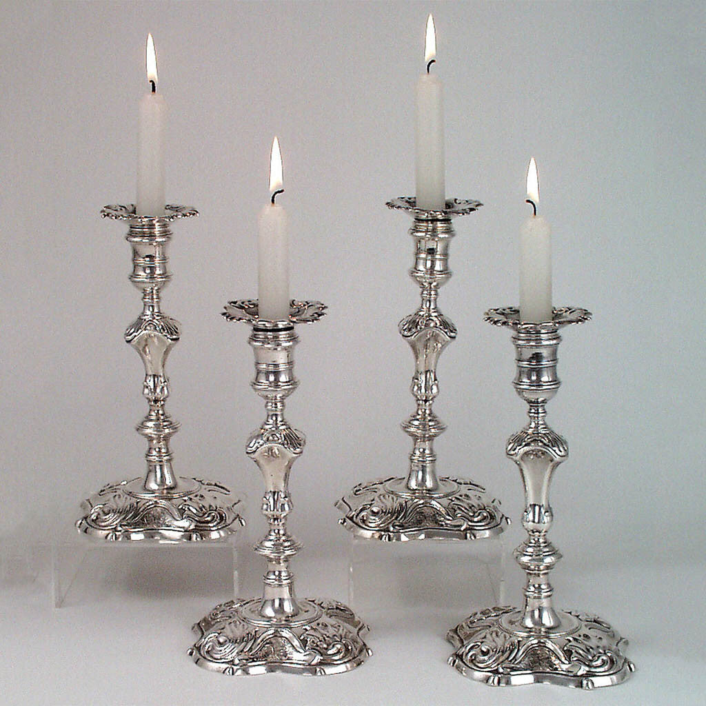 Four George II candlesticks, 3 James Gould, 1 Eliza(beth) Godfrey, c. 1740's