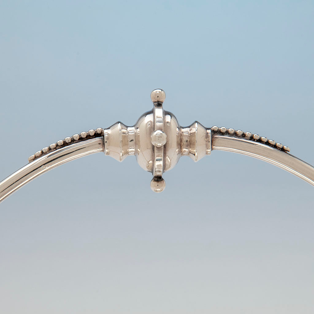 Decorative handle join of Wood and Hughes Antique Coin Silver &#39;Medallion&#39; Basket, NYC, NY, c. 1870