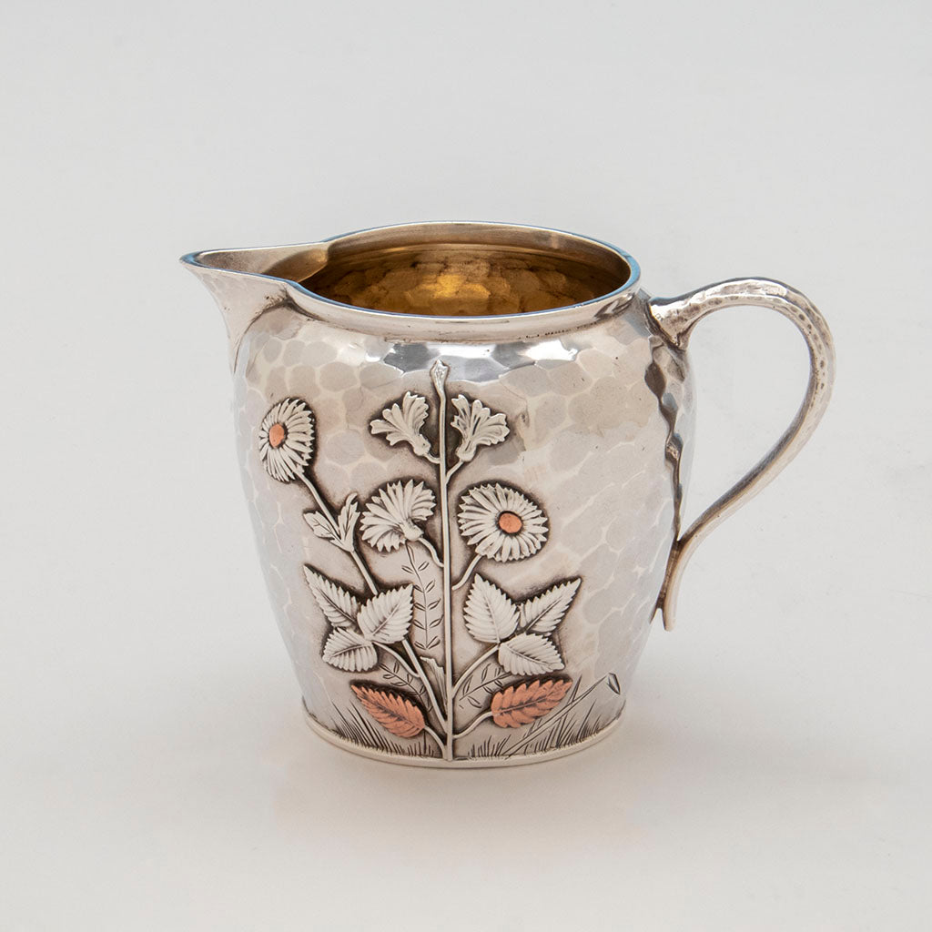 Creamer flower details on Whiting Aesthetic Movement Sterling Silver and Mixed-Metal Tête-à-tête Tea Service, c. 1880