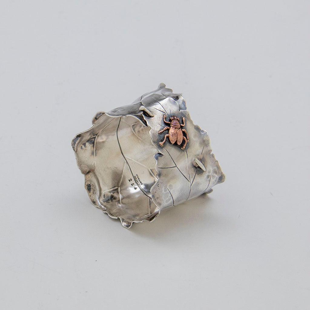 Angle view of George Shiebler Aesthetic Antique Sterling &amp; Mixed Metal Napkin Ring, NYC, NY, c. 1880s