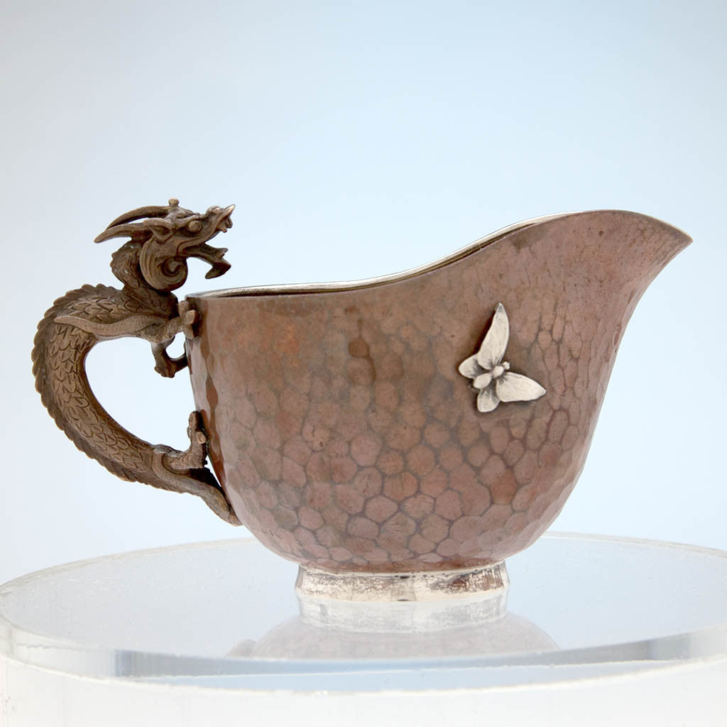 Reverse side of creamer to Gorham Copper and Applied Silver Creamer and Sugar with Dragon Handles, Providence, RI, 1884