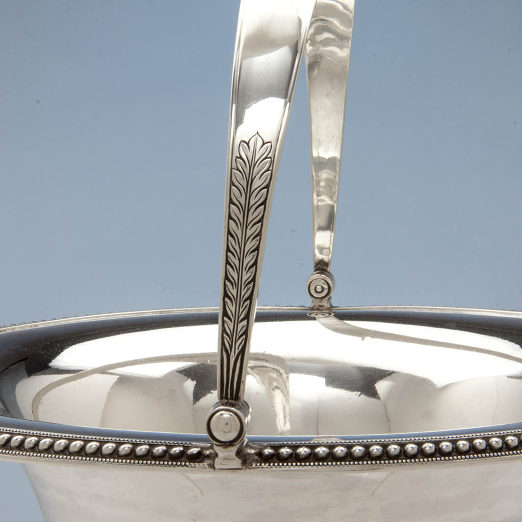 Handle decoration on Harvey Lewis Antique Coin Silver Swing-handle Basket, Philadelphia, 1811-1828
