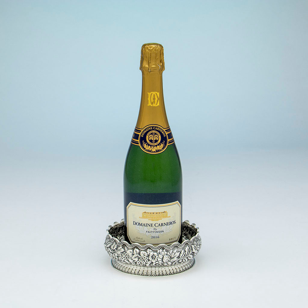 Champagne borrle in Tiffany &amp; Co Antique Sterling Silver Wine Coaster, NYC, NY, c. 1875