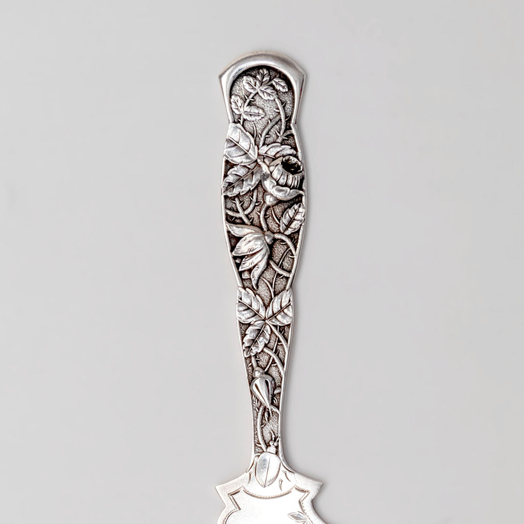 Handle details of the Knowles Rose Pattern Antique Sterling Silver Cake Saw, Providence, c. 1890