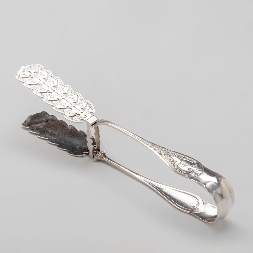 Angle view of John Wendt &quot;Florentine&quot; Pattern Antique Sterling Silver Asparagus Tongs, NYC, c. 1870s